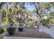 Scenic brick porch with views of lush greenery and trees at 212 Chinaberry Ln, Kiawah Island, SC 29455