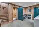 Basement features a unique lift, wood paneled walls, and doorway leading to additional space at 212 Chinaberry Ln, Kiawah Island, SC 29455