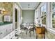 Elegant bathroom with a clawfoot tub, vanity area, and a separate shower, all bathed in natural light at 212 Chinaberry Ln, Kiawah Island, SC 29455