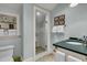Bright bathroom featuring tiled floor, a glass enclosed shower, and ample storage at 212 Chinaberry Ln, Kiawah Island, SC 29455