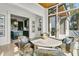 Charming dining area with seating for four and views of the kitchen and outdoor space at 212 Chinaberry Ln, Kiawah Island, SC 29455