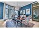 Charming dining room featuring large windows, stylish rug, and chandelier at 212 Chinaberry Ln, Kiawah Island, SC 29455