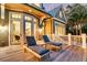 Exterior patio featuring comfortable lounge seating, privacy, and access to the home's interior at 212 Chinaberry Ln, Kiawah Island, SC 29455