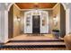 Inviting front porch with decorative lighting and planter at 212 Chinaberry Ln, Kiawah Island, SC 29455