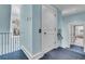 Hallway with blue walls, a doorway, and an elevator at 212 Chinaberry Ln, Kiawah Island, SC 29455