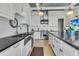 Modern kitchen features an oversized island, stainless appliances, and white subway tile backsplash at 212 Chinaberry Ln, Kiawah Island, SC 29455