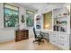 Charming office space featuring custom built-ins, hardwood floors, and a comfortable desk setup at 212 Chinaberry Ln, Kiawah Island, SC 29455