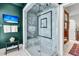 Luxurious shower features marble tile, glass enclosure, a built-in bench, and modern fixtures at 212 Chinaberry Ln, Kiawah Island, SC 29455