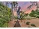 Outdoor art sculpture with blue sky and marsh views on the home's well-manicured property at 212 Chinaberry Ln, Kiawah Island, SC 29455