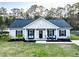 Aerial view of a single story home with a large front yard and well kept lawn and landscaping at 218 Mohican Cir, Summerville, SC 29483
