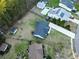 Spacious yard featuring mature trees, a swimming pool and rear storage shed at 218 Mohican Cir, Summerville, SC 29483