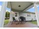 Covered back porch with outdoor furniture, perfect for relaxing or entertaining at 218 Mohican Cir, Summerville, SC 29483