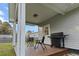 Covered back porch with outdoor seating and a grill at 218 Mohican Cir, Summerville, SC 29483