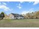 Spacious backyard featuring a deck, a grill and green grass at 218 Mohican Cir, Summerville, SC 29483