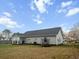 Backyard featuring a home and trampoline against a blue sky at 218 Mohican Cir, Summerville, SC 29483