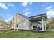 An exterior view of the home's backyard with a covered deck at 218 Mohican Cir, Summerville, SC 29483