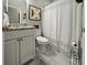 A well-lit bathroom featuring a marble countertop and framed artwork at 218 Mohican Cir, Summerville, SC 29483