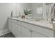 Bathroom with a double sink vanity featuring a gray granite countertop at 218 Mohican Cir, Summerville, SC 29483