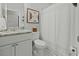 Bathroom with a granite vanity, decorated walls, and a white toilet and shower at 218 Mohican Cir, Summerville, SC 29483