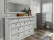 Bedroom featuring a white dresser, mirror, and gray accents at 218 Mohican Cir, Summerville, SC 29483