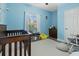 A baby blue Bedroom with a crib, rocking chair, and decorative wall art at 218 Mohican Cir, Summerville, SC 29483