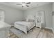 Bedroom with a bed with gray linens, white dressers and blue rug at 218 Mohican Cir, Summerville, SC 29483