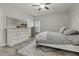 Bedroom with a bed with gray linens, white dressers and blue rug at 218 Mohican Cir, Summerville, SC 29483