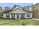 Charming single story home with a covered front porch and well maintained lawn and landscaping at 218 Mohican Cir, Summerville, SC 29483