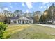 Beautiful single-story home featuring a well-manicured lawn, covered porch, and a long drive at 218 Mohican Cir, Summerville, SC 29483