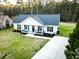 Aerial of a well kept single story home with a long drive and manicured landscaping at 218 Mohican Cir, Summerville, SC 29483