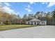 Single story home with a covered front porch, long drive and lush, green lawn at 218 Mohican Cir, Summerville, SC 29483