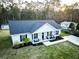 Inviting single story home with covered porch, seating and well-maintained lawn at 218 Mohican Cir, Summerville, SC 29483