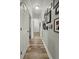 Hallway with light hardwood floors, gray walls and white trim at 218 Mohican Cir, Summerville, SC 29483