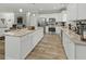 Kitchen with island seating, hardwood floors, granite countertops, and stainless steel appliances at 218 Mohican Cir, Summerville, SC 29483