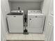 White washer and dryer set with cleaning supplies at 218 Mohican Cir, Summerville, SC 29483