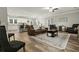 Open concept living room and kitchen boasting wood flooring and ample seating at 218 Mohican Cir, Summerville, SC 29483