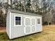 A well-maintained utility shed with double doors and windows at 218 Mohican Cir, Summerville, SC 29483