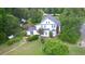 Aerial view of home featuring lush backyard, flowers, and beautiful lawn at 219 Rigby St, Reevesville, SC 29471