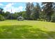 Expansive backyard with lush green grass and a charming gazebo at 219 Rigby St, Reevesville, SC 29471