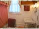 Bright bathroom features a sink and vanity, with warm lighting and stylish red accents at 219 Rigby St, Reevesville, SC 29471