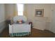 Quaint bedroom featuring a cozy bed, soft natural light, and a decorative fireplace at 219 Rigby St, Reevesville, SC 29471