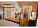 Bedroom with floral wallpaper, traditional furnishings and glimpse into the home's hallway at 219 Rigby St, Reevesville, SC 29471