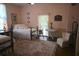 Inviting bedroom featuring a comfortable bed, classic decor, and soft natural light at 219 Rigby St, Reevesville, SC 29471