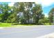Charming two-story home with mature trees, a manicured lawn, and a classic architectural design at 219 Rigby St, Reevesville, SC 29471
