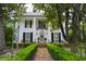 Stunning two-story home with brick path, manicured hedges, and lush green landscaping at 219 Rigby St, Reevesville, SC 29471