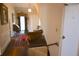 Hallway view shows staircase and ornate decor in a traditionally styled home at 219 Rigby St, Reevesville, SC 29471
