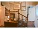 Hallway with wood railing and vintage clock on a wooden chest at 219 Rigby St, Reevesville, SC 29471