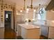Well-lit kitchen with stainless steel appliances, granite countertops, and a farm sink at 219 Rigby St, Reevesville, SC 29471