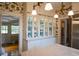 Bright kitchen with stainless steel appliances, white cabinets, and views to another room at 219 Rigby St, Reevesville, SC 29471