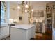 Bright kitchen equipped with stainless steel appliances, an island, and white cabinetry at 219 Rigby St, Reevesville, SC 29471